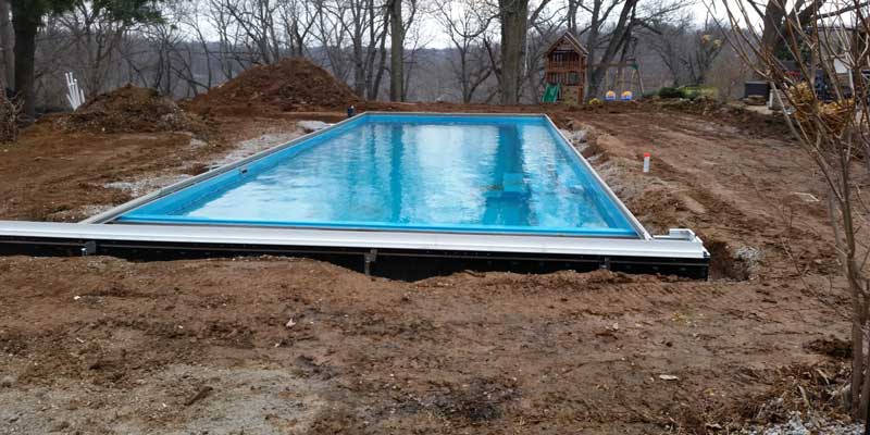 Backfill with sand and fill the pool with water